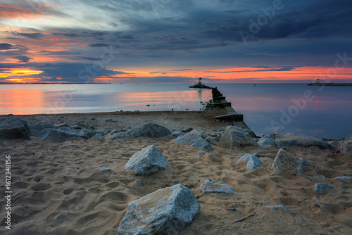 Fototapeta Naklejka Na Ścianę i Meble -  Sunset over the Baltic Sea beach in Gorki Zachodnie, Gdansk. Poland