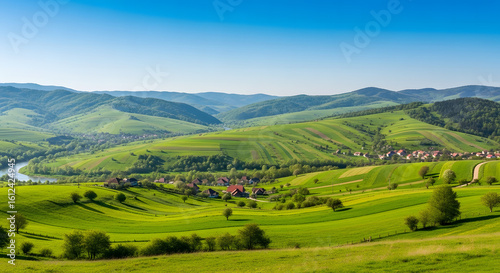A peaceful village nestled in a valley of rolling green hills