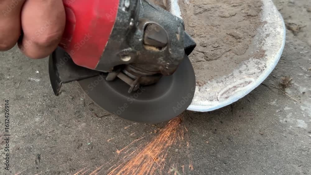 sharpening a bayonet shovel with a grinder. High quality 4k footage