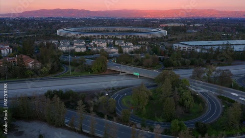 Timelapse aerial view of Apple Park headquarters. Shows the building's unique ring-shaped design.  Cupertino, California, USA.