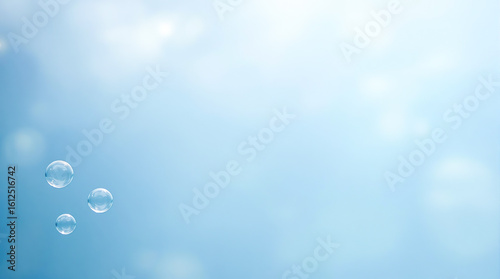 水色の背景に浮かぶ3つのシャボン玉のような泡