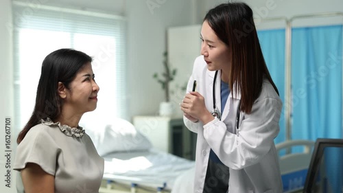 Wallpaper Mural Female medical professional carefully examining mature patient's eyes during comprehensive ophthalmological consultation, performing vision assessment in clinic. Torontodigital.ca