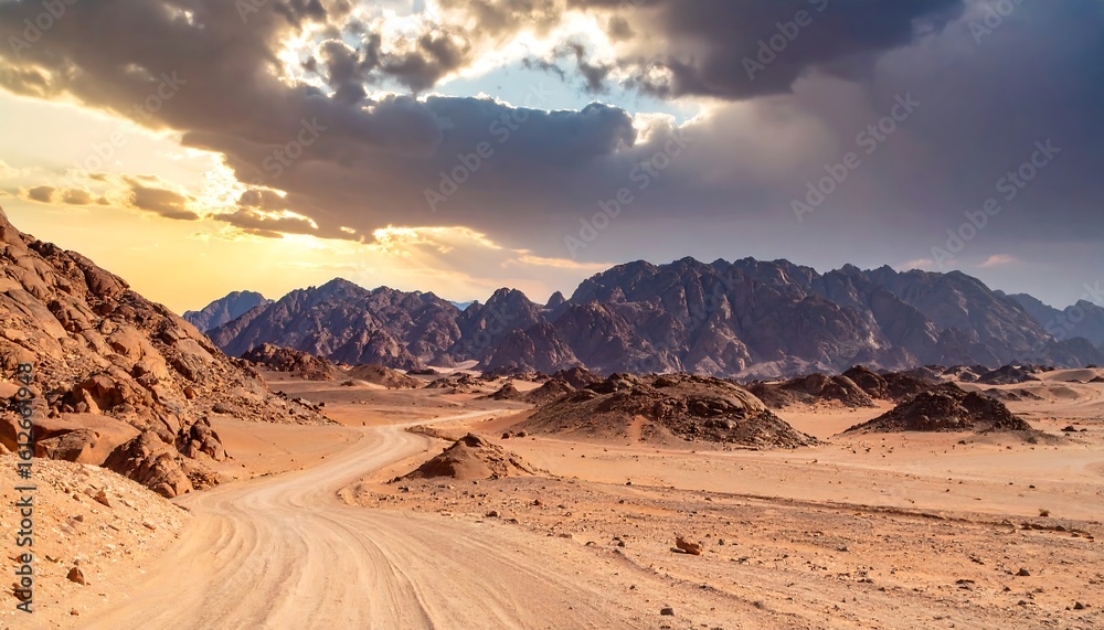 Naklejka premium Desert road, dramatic sunset