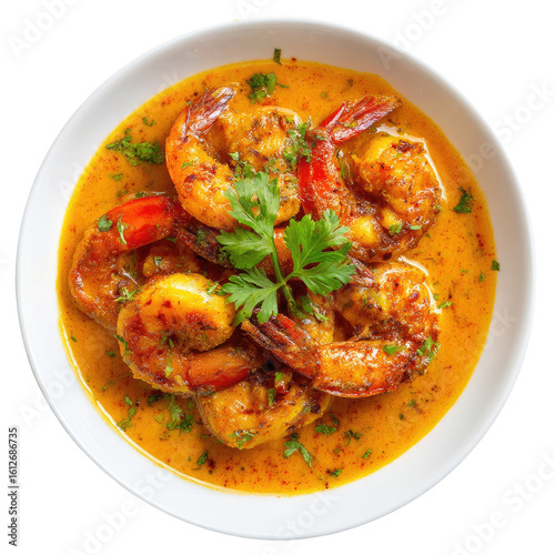 Creamy orange shrimp curry in a white bowl
