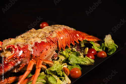 Grilled Lobster Served on Fresh Salad with Gourmet Sides