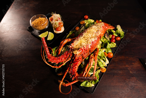 Grilled Lobster Served on Fresh Salad with Gourmet Sides