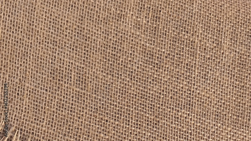 Brown sackcloth texture. or Background of Natural Brown Fabric Sack weaving is a bag.