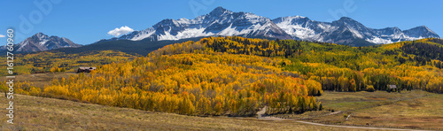 Autumn at Wilson Peak - A panoramic Autumn view of snow-capped Wilson Peak, surrounded by dense golden aspen forest. Telluride, Colorado, USA.