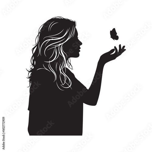 Silhouette of a woman with flowing hair gently touching a butterfly