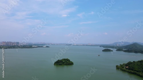 Explore stunning aerial views of Dongting Lake Tourist Resort in Yueyang, Hunan Province on a sunny day