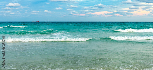 Fototapeta Naklejka Na Ścianę i Meble -  Romantic summer vacation at seascape. Sunset sea and seascape. Sea horizon view. Cloudy sky and seascape at summer vacation. Skyscape with sea horizon. Calm horizon with sea nature. Horizon at sunset