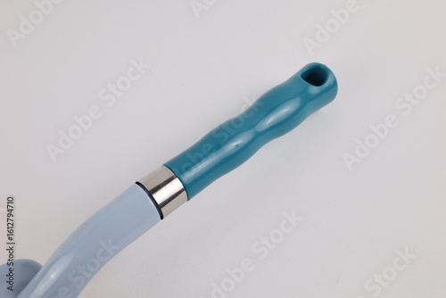 Hard bristle cleaning brush with long blue handle and ergonomic gray grip, isolated on white background