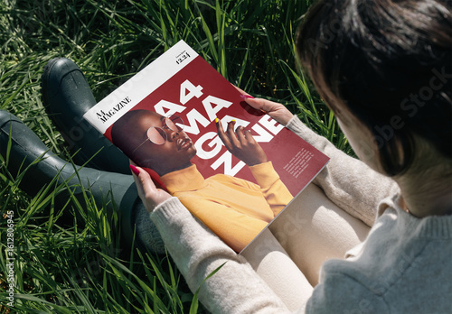 Mockup Of Woman Reading Customized A4 Magazine On Grass