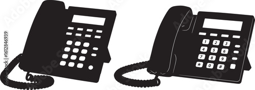 Two black office telephones in silhouette