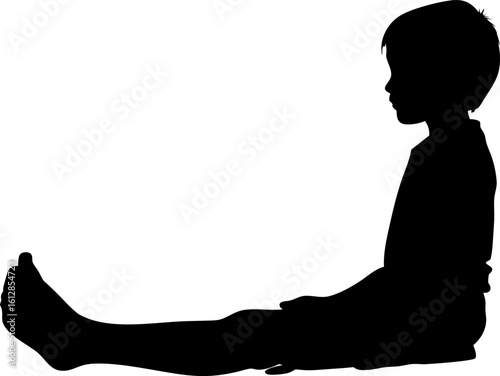 Silhouette of Boy Sitting Sideways in Stillness on Ground Against a Stark White Background