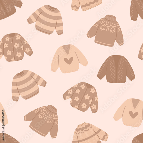 Pattern with cute warm autumn sweaters. Seamless hand-drawn texture with cozy knitted cardigans. Vector background in beige colors.