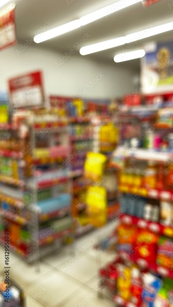 Fototapeta premium Abstract defocused background of a minimarket or convenience store. Blurred minimarket shop