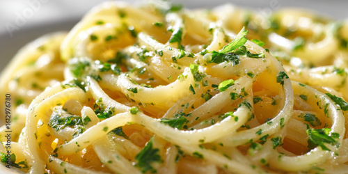 Garlic butter pasta topped with chopped parsley