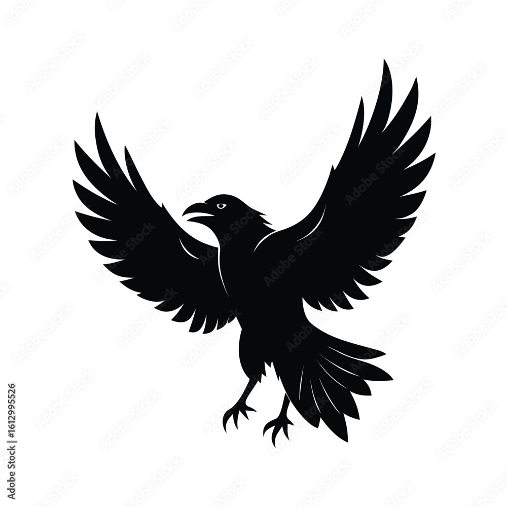 Obraz premium Striking black silhouette of a crow in full flight with wings extended