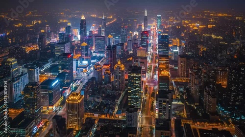 Aerial Night View of a City Illuminated with Golden and White Lights and Roads