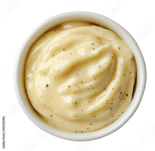 Creamy textured mayonnaise or aioli sauce in a white bowl on a transparent background