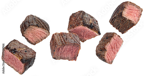 Canvastavla Medium rare steak pieces, sliced grilled beef cubes isolated on white background
