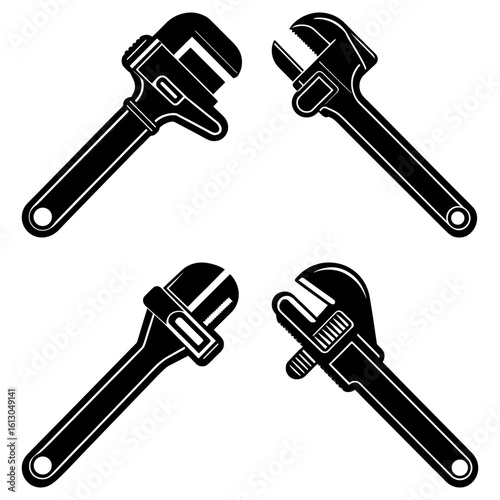 Four black and white adjustable wrenches arranged symmetrically on a plain white background in a square format