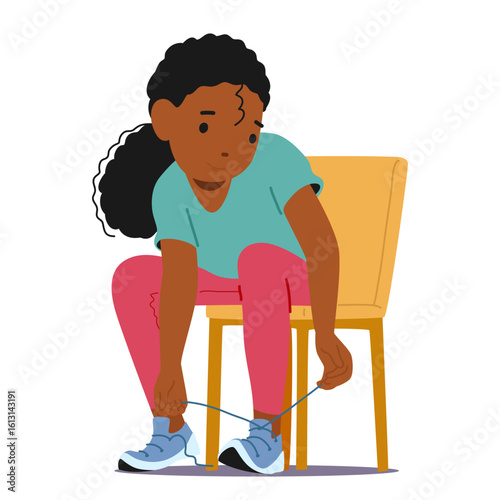 Concentrated little preschool girl kid cartoon character learning to tie shoelaces sitting on chair