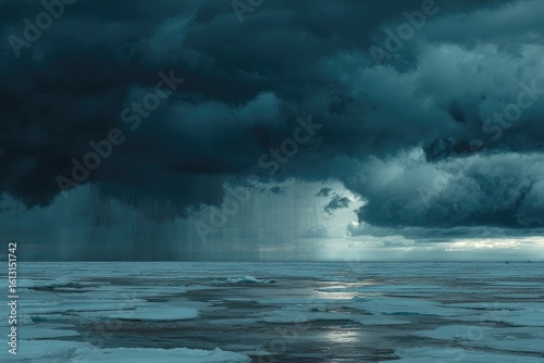 Dramatic storm clouds over icy sea