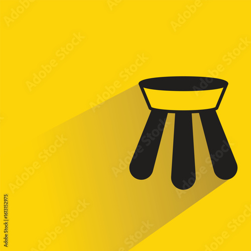 stool icon with shadow on yellow background