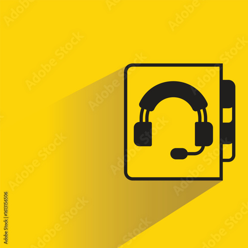 contact book icon with shadow on yellow background