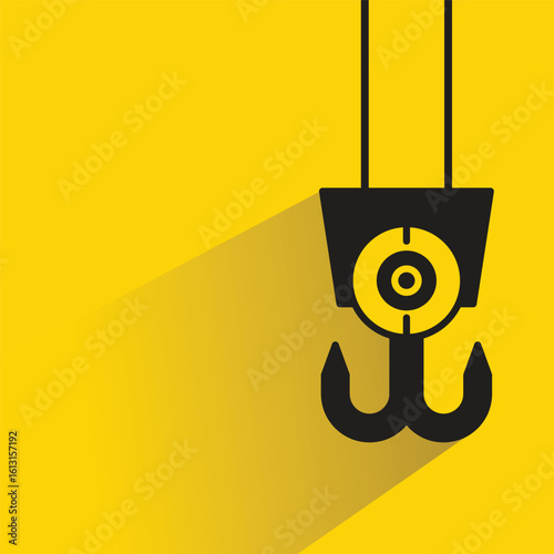 pulley crane hook icon with drop shadow on yellow background