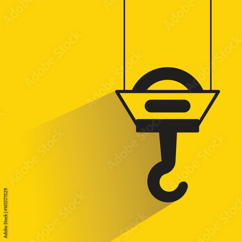 hoist and hook icon with drop shadow on yellow background