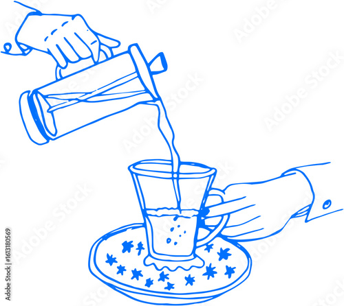 Hand pouring tea into a glass on a plate — dynamic and warm