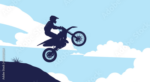 A Silhouette of a Motocross Rider Performing a Jump Against a Bright Blue Sky with Clouds