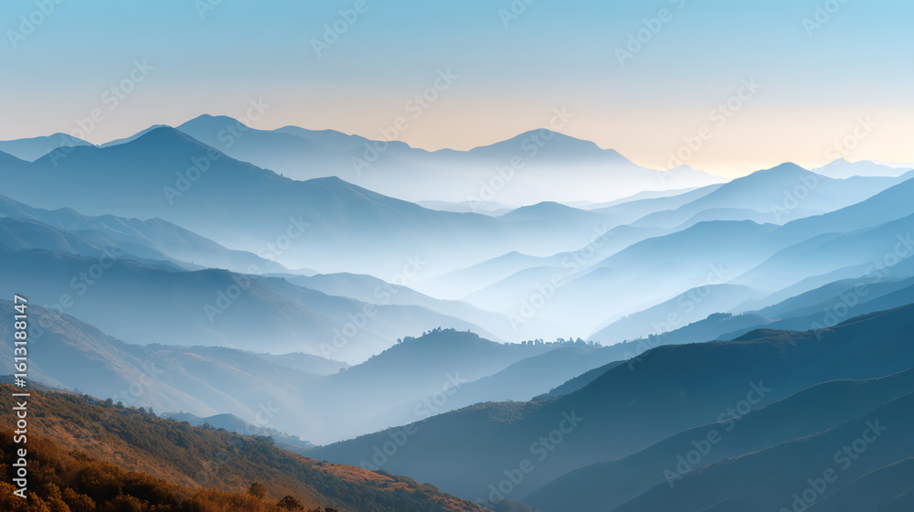 Obraz premium A breathtaking view of misty mountains capturing the serene beauty of nature at dawn.