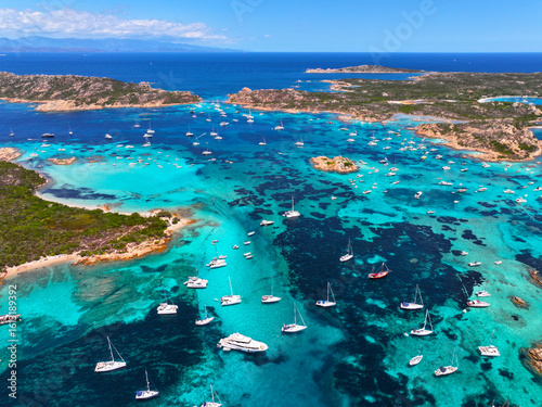Fototapeta Naklejka Na Ścianę i Meble -  Isola Budelli. Arcipelago della Maddalena. Island Budelli. Sardinia, Italy. Beaches of Sardinia. Boats and yachts. Incredible colors and views. View from above. Drone view of Sardinia. Sea. Ocean.