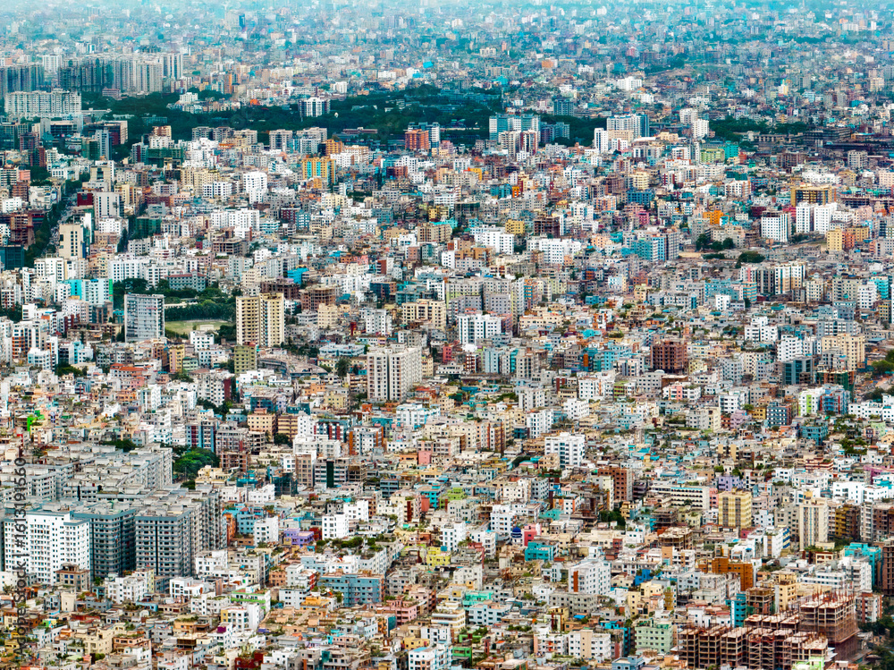 Aerial view of a dense urban landscape unfolds with a tapestry of buildings, streets, and structures creating a vibrant mosaic, Dhaka, Dhaka Division, Bangladesh. Aerial view of a dense urban landscape unfolds with a tapestry of buildings, streets, and structures creating a vibrant mosaic, Dhaka, Dhaka Division, Bangladesh.