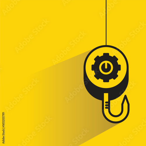 pulley crane hook icon with drop shadow on yellow background