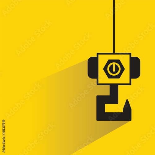 hoist crane hook icon with shadow on yellow background