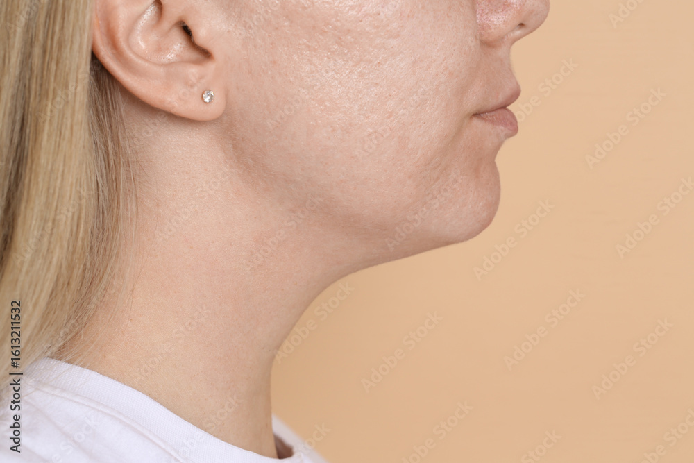 Fototapeta premium Closeup view of woman on beige background, space for text