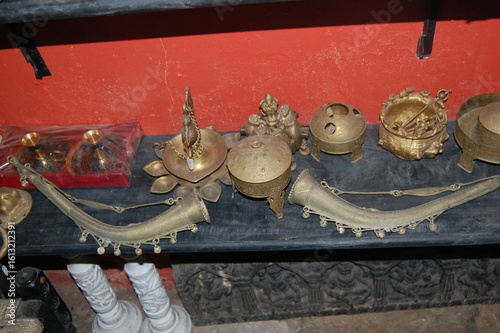 An old, golden bronze temple bell, an ancient Asian metal art sculpture