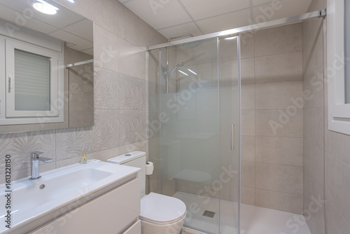 Modern bathroom with walk-in shower and minimalist design