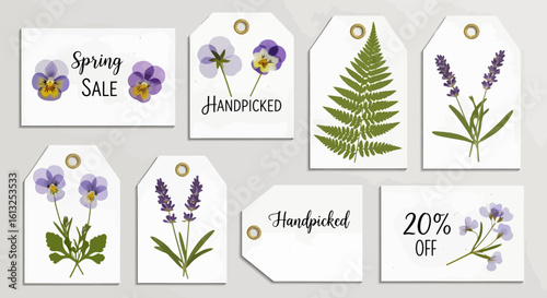 Charming collection of gift tags featuring delicate pressed flowers and sale announcements perfect for spring promotions and artisanal crafts