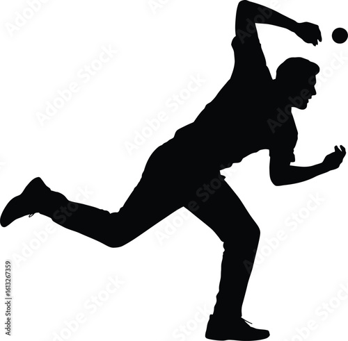 Dynamic silhouette of a male cricket bowler in mid action throwing a ball