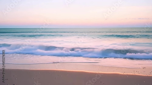 Horizontal video waves washing onto sandy beach from sea or ocean