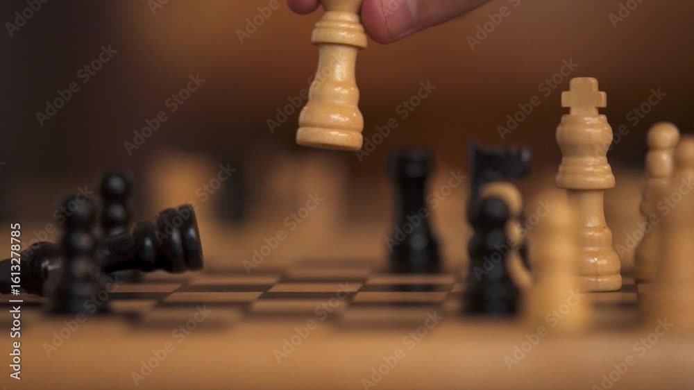 Close Up of Hand Confident Businessman Playing Chess Game to Development Analysis Strategy Plan, Leader Teamwork for Success. Business Solutions, Success Strategy. kill king. defeat loss win victory Close Up of Hand Confident Businessman Playing Chess Game to Development Analysis Strategy Plan, Leader Teamwork for Success. Business Solutions, Success Strategy. kill king. defeat loss win victory