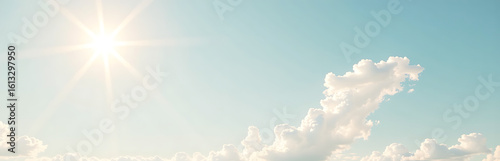 gentle pastel blue sky wispy fluffy white clouds stretches across frame bathed warm sunlight casts soft glow