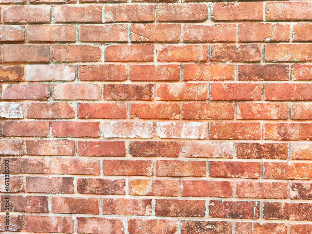 Obraz premium Rustic red brick wall with textured surface and ample space for creative text placement