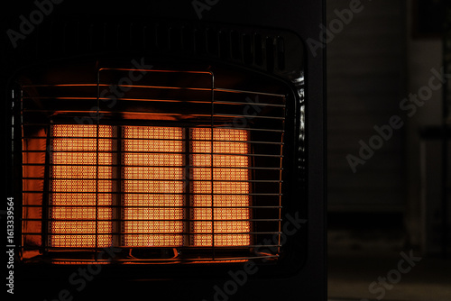 Konstfotografi Close-up of a glowing infrared heater with a warm, inviting glow